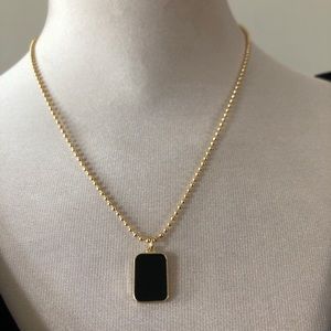 Black and gold plate with round beaded chain